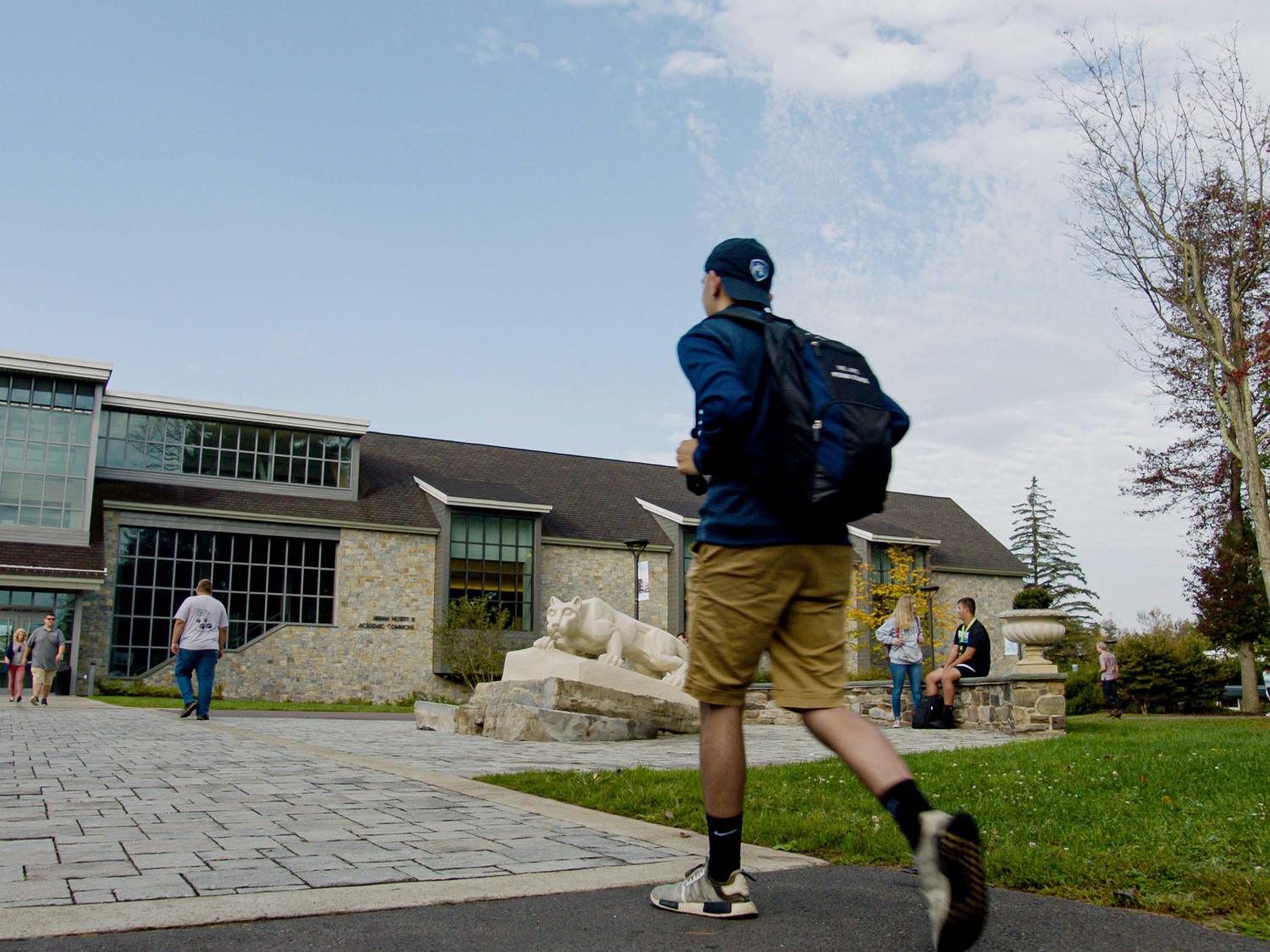 Student walking toward a campus building