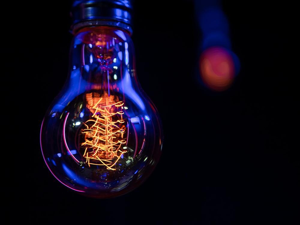 A lightbulb on a black background.