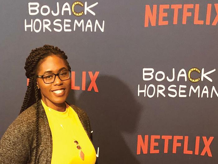 Penn State Behrend alumna Chikodili Agwuna poses on the red carpet at a Netflix release party.