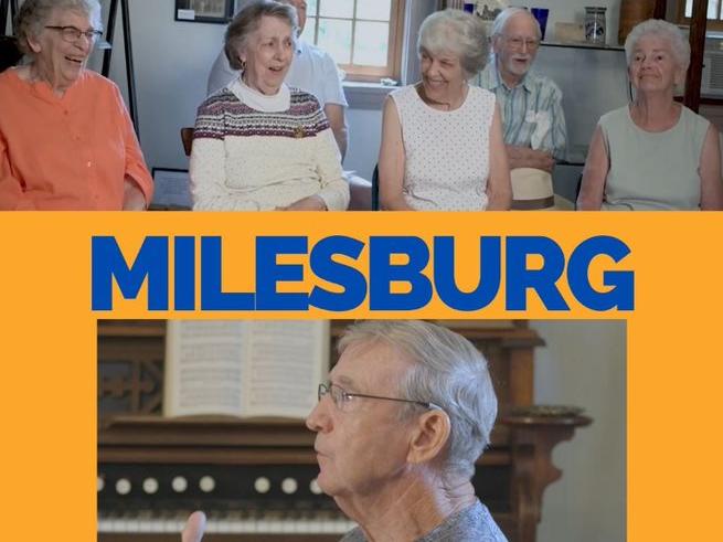 Promotional poster with the name of a small Pennsylvania town called Milesburg written in blue letters on a yellow background
