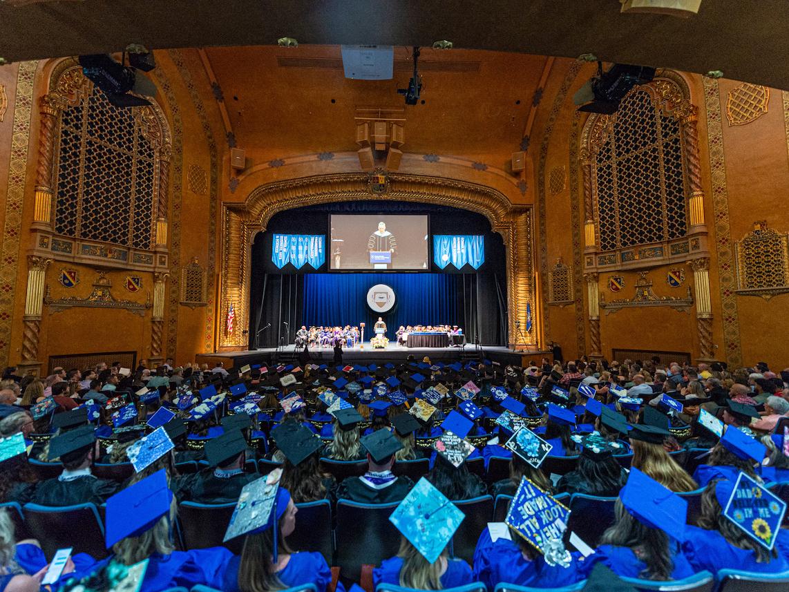 Graduates gather at the Community Arts Center in Williamsport for Penn College commencement.