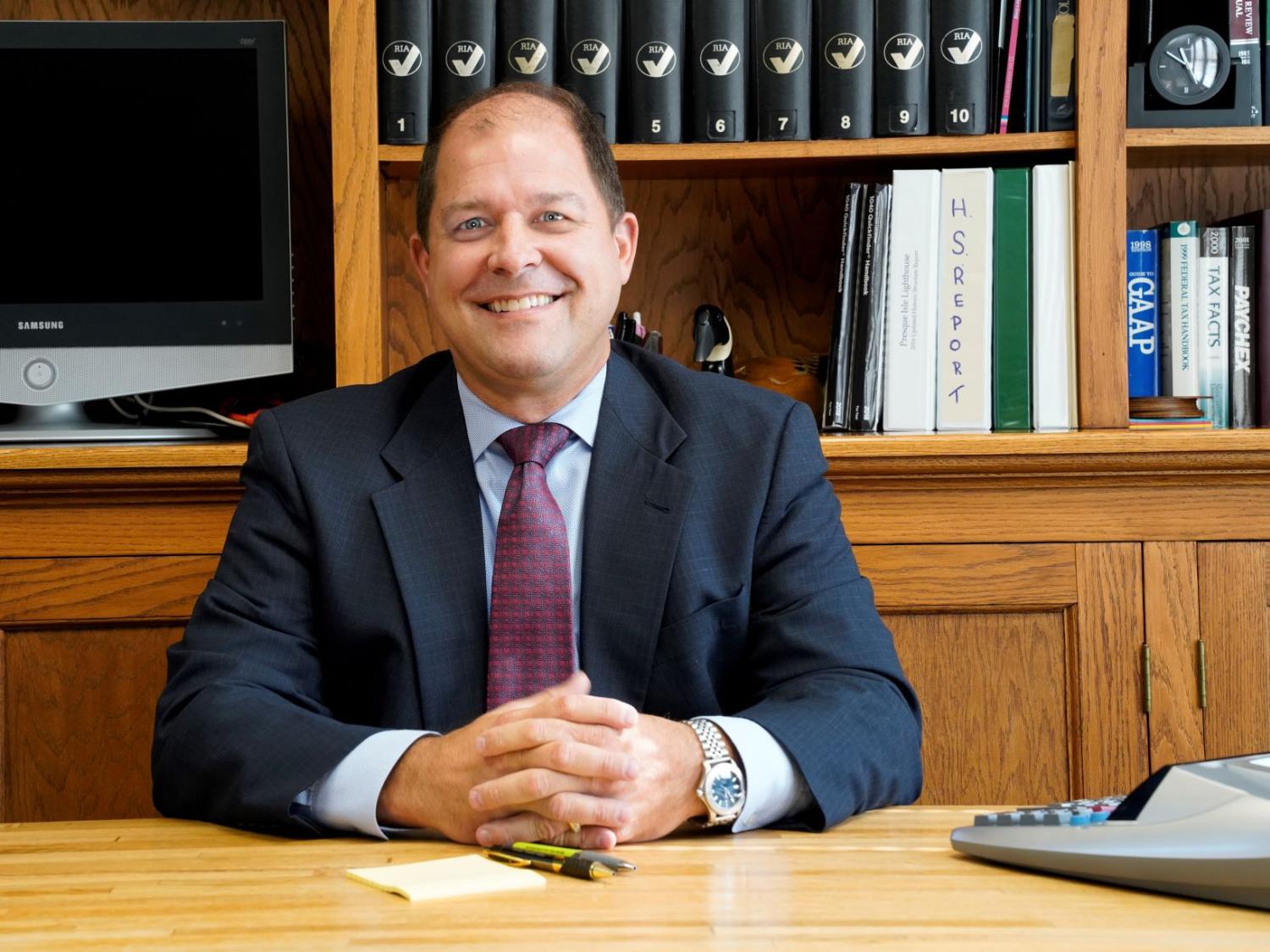 A portrait of Christopher A. Elwell, an executive in residence at Penn State Behrend's Black School of Business.