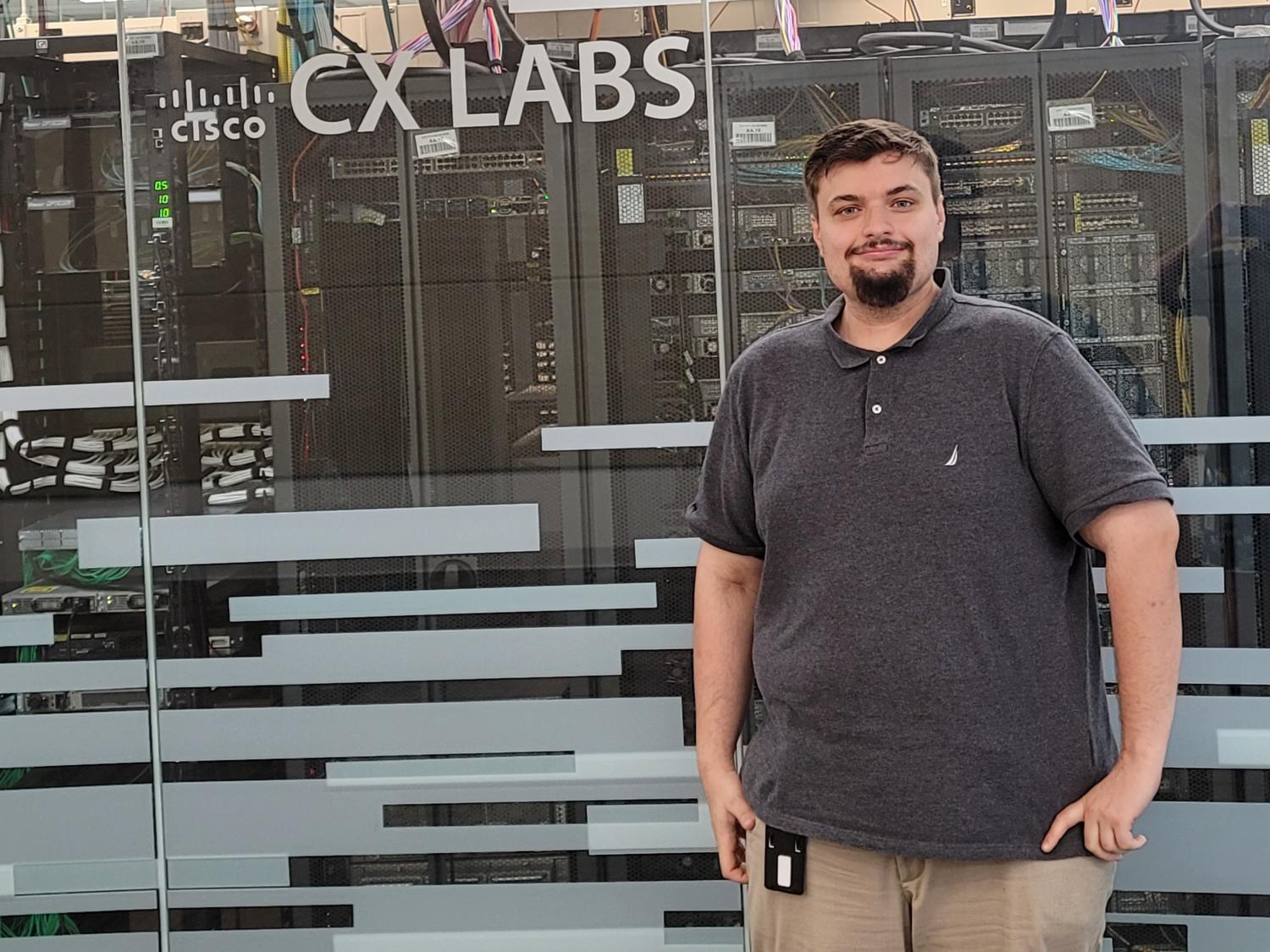 James Reese stands in front of the CISCO CX Labs
