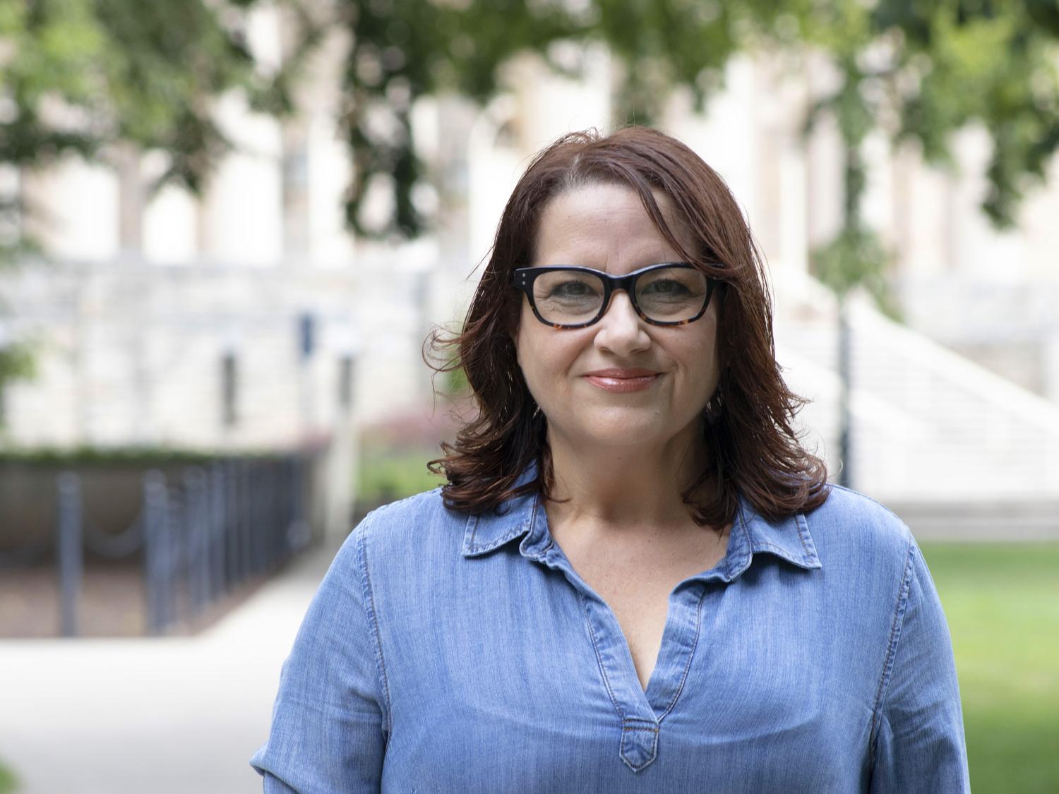 Lourdes Mestre stands in front of Old Main.
