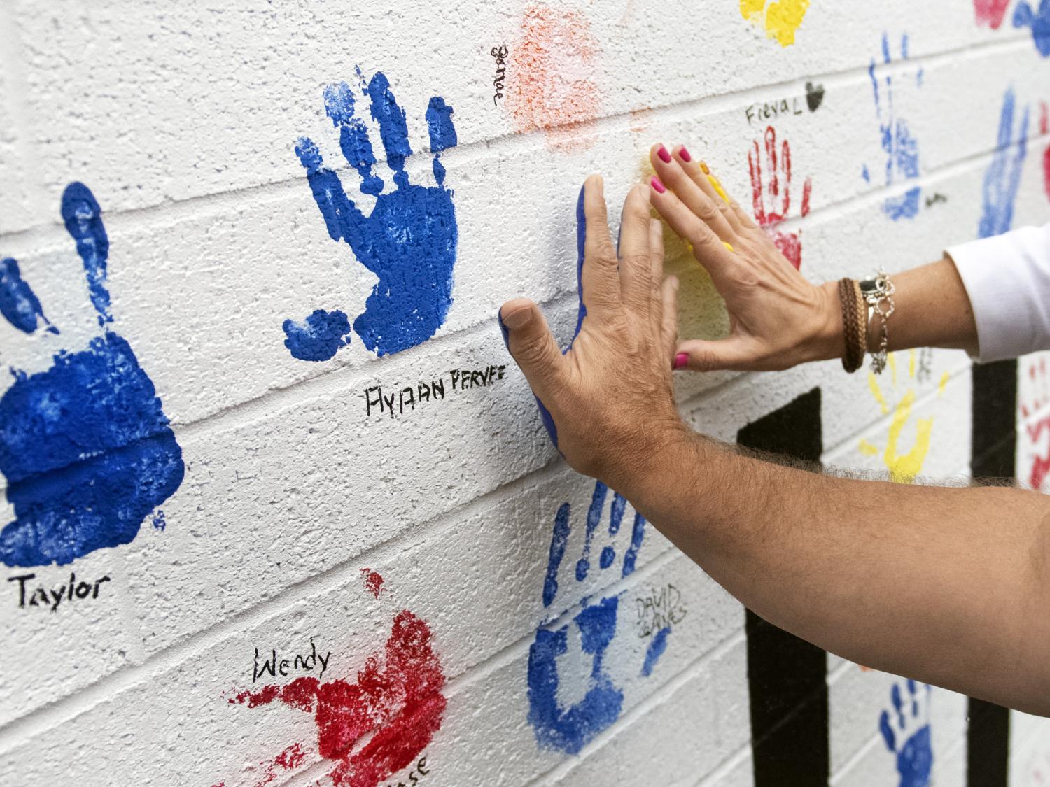 donors add handprints to new all hands on deck mural