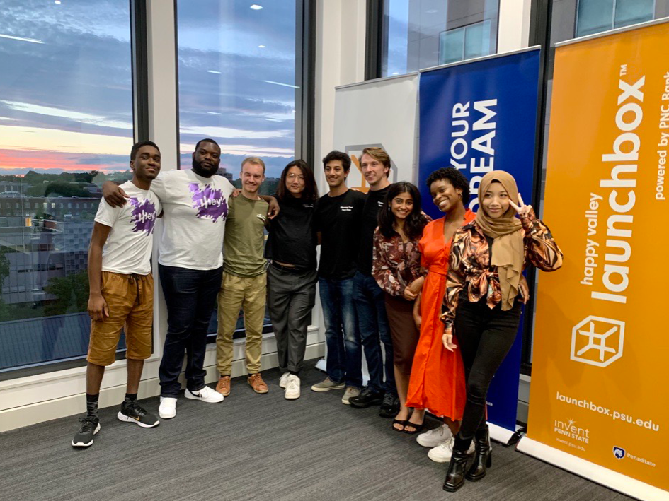 Summer Founders Program founders standing in front of LaunchBox banners