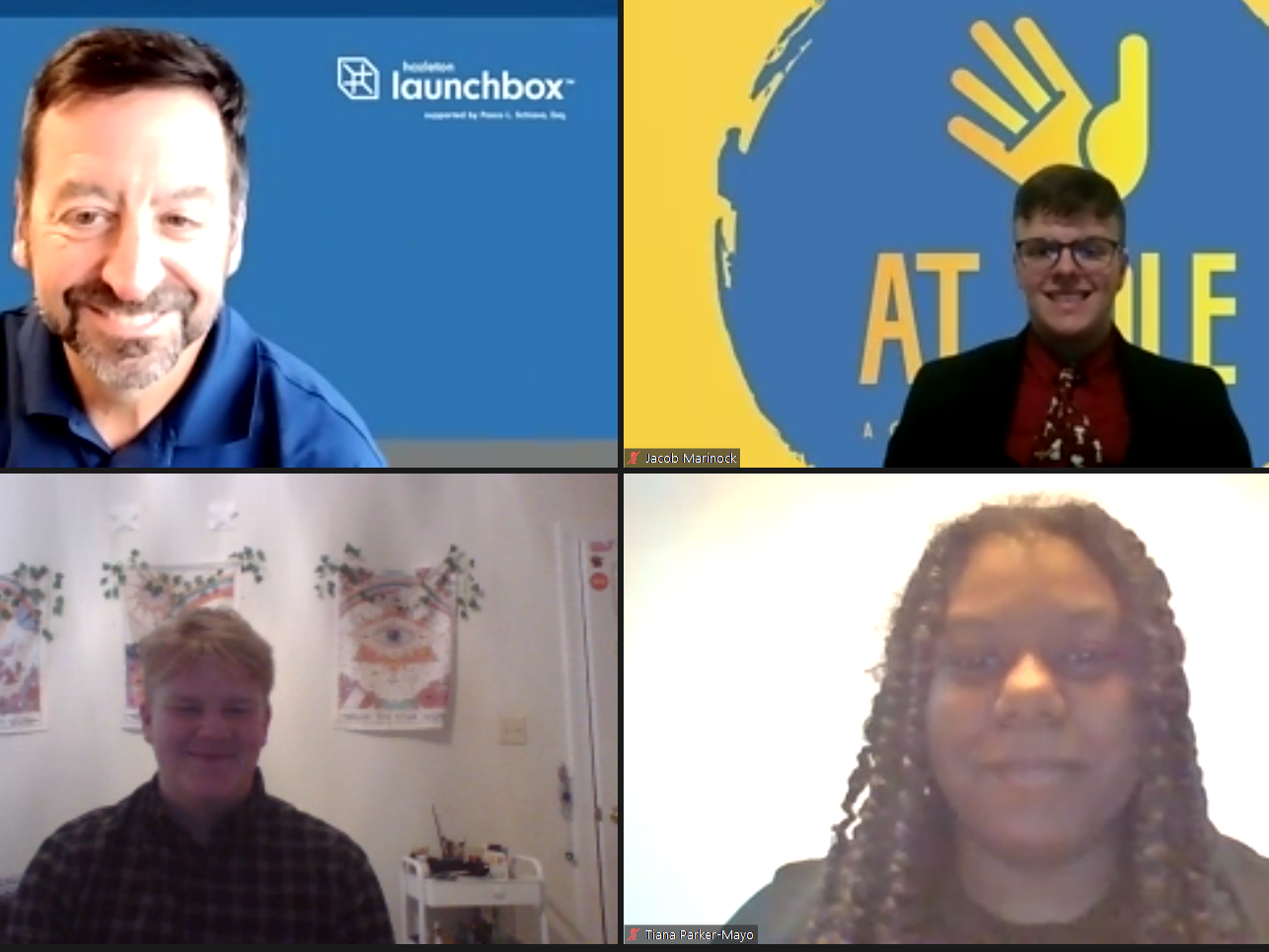 Three students and an instructor smiling in an online conference room.