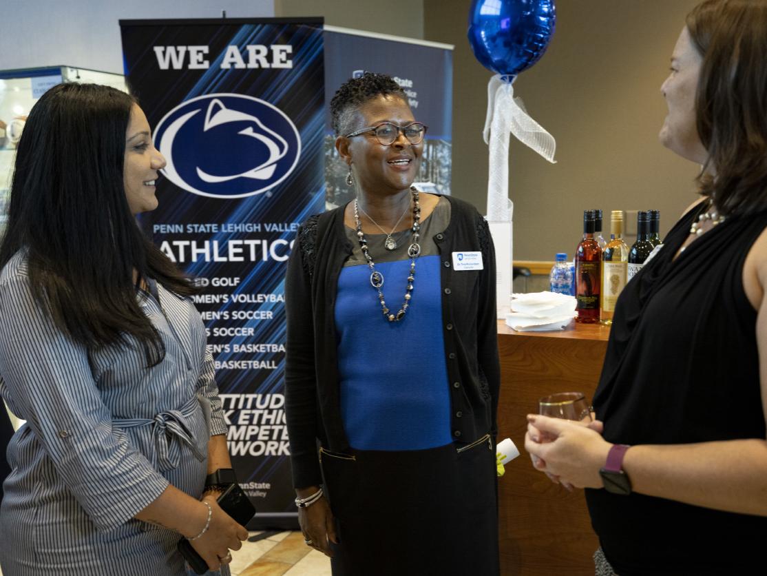 Chancellor Richardson speaking with Christina Luey and Hiba Moussa 