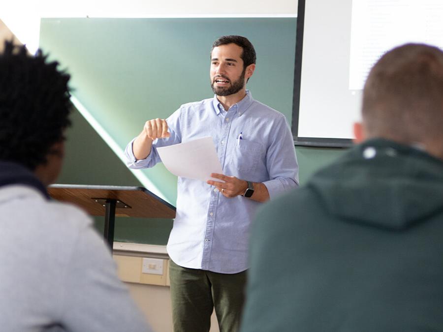 Professor giving a lecture in front of a classroom of students