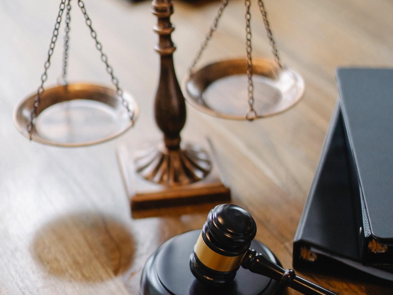 Justice scales, gavel, and books.