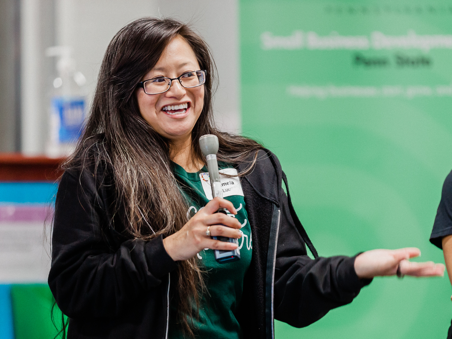 Person speaking into microphone