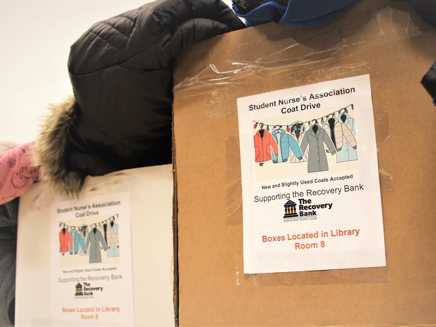two boxes filled with coats have been collected for the SNA's coat drive