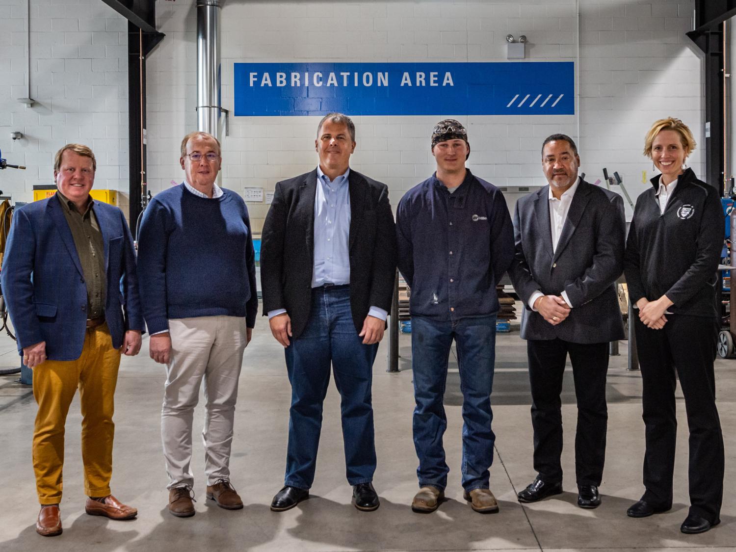 A group of people standing in a row
