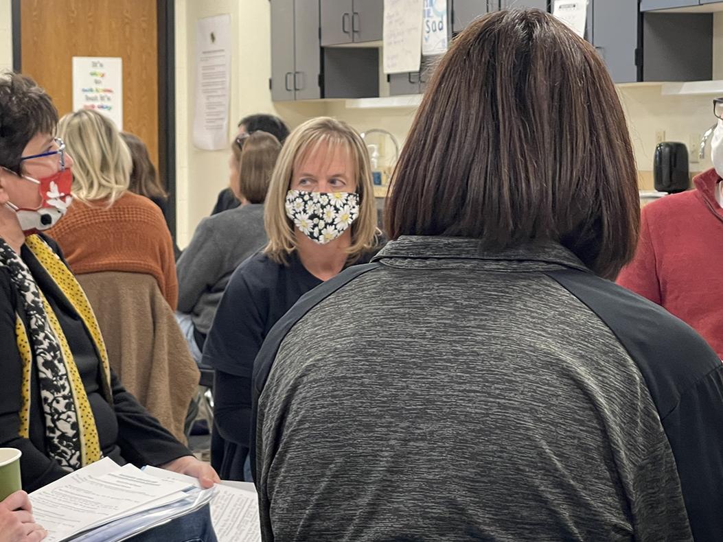 teachers sitting in a circle for a discussion