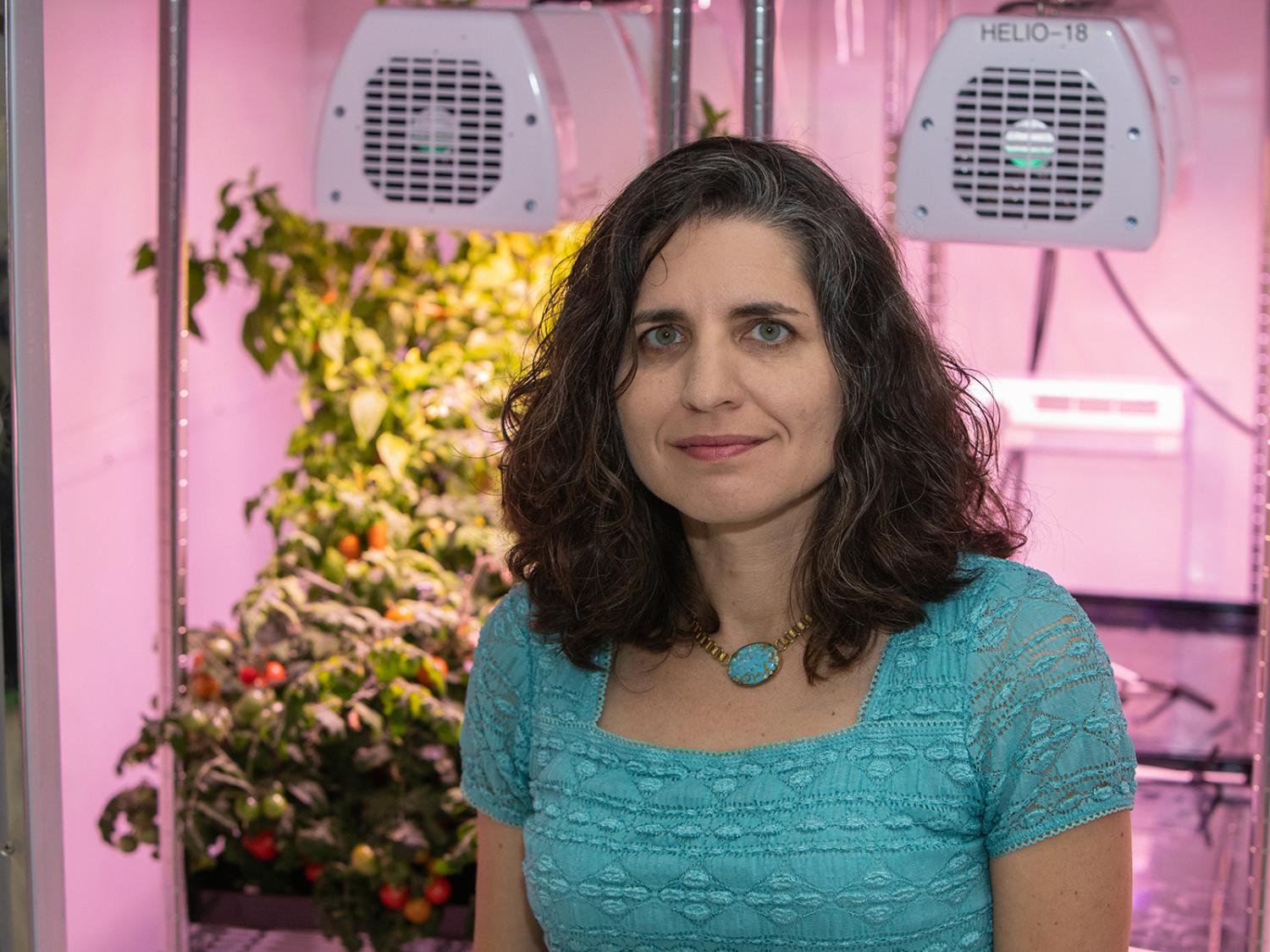 Dr. Gioia Massa poses in a lab at NASA's Kennedy Space Center