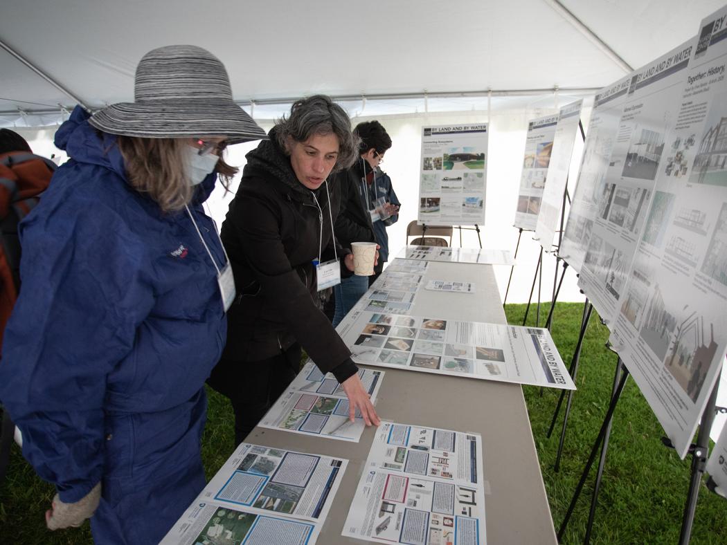 Lisa Iulo at center points to flood maps on a table in front of her to residents of Selinsgrove, Pennsylvania. 