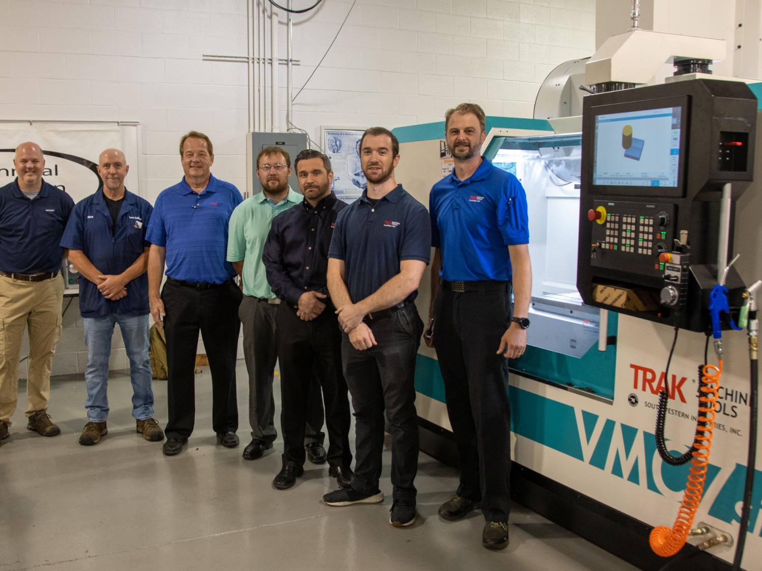 Group photo with donated machines