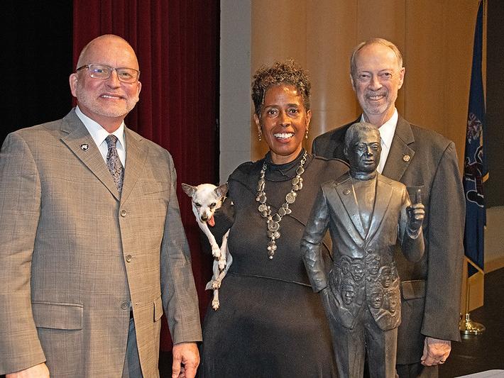 Charles Patrick, chancellor, with Vinnie Bagwell, sculptor, and Robert Eberly Jr., president of the Eberly Foundation