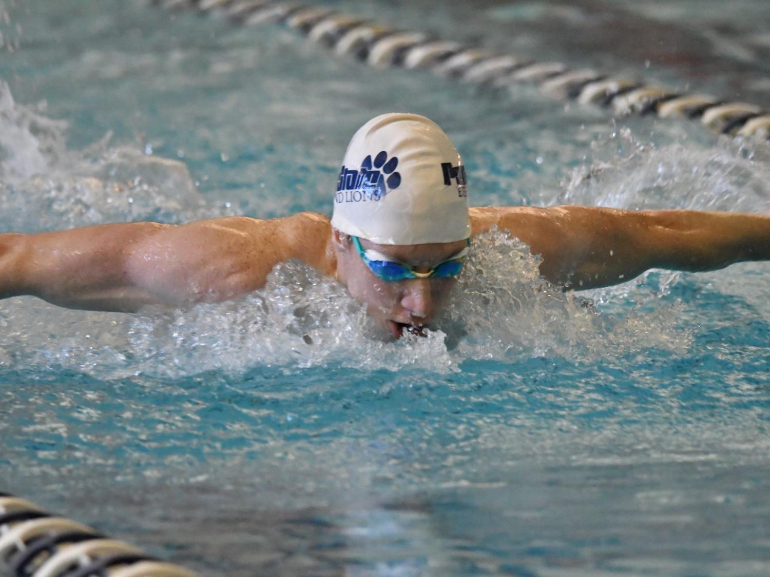 Penn State Behrend swimmer Tim Compton competes in a fly event.