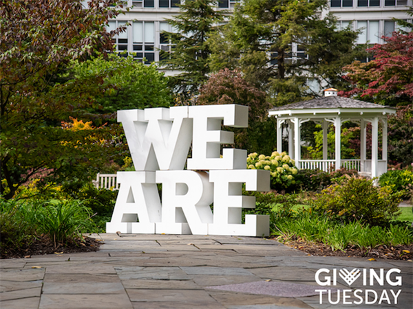Letters spelling out the words "We Are" with the words "Giving Tuesday" in the bottom right corner