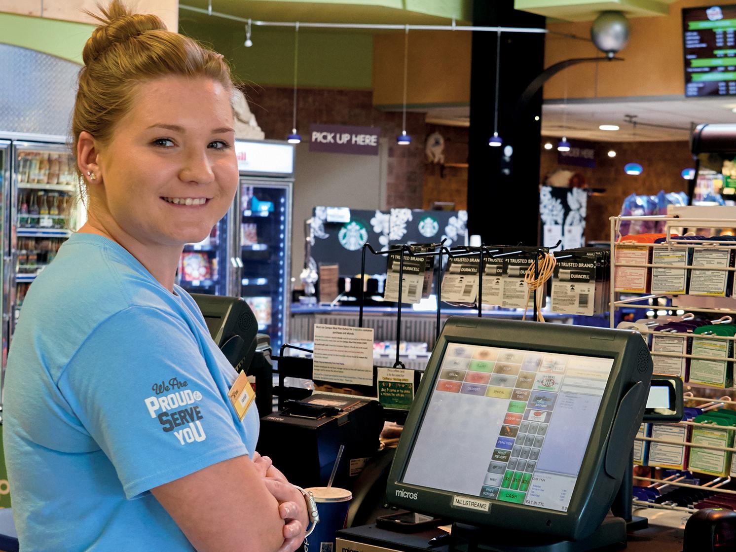 Worker in food service convenient store looking at the camera and smiling
