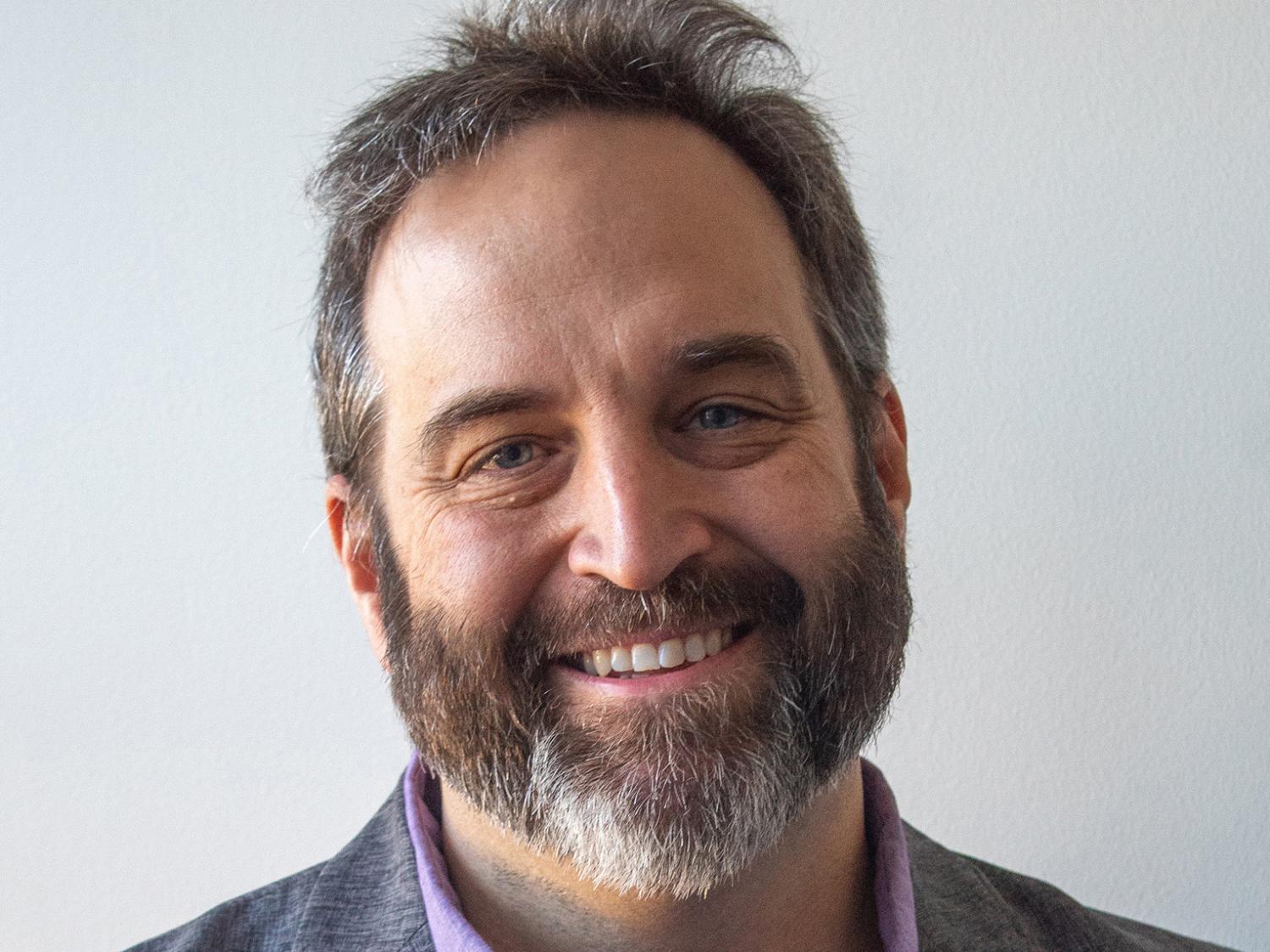 Headshot photo of Eli Hughes