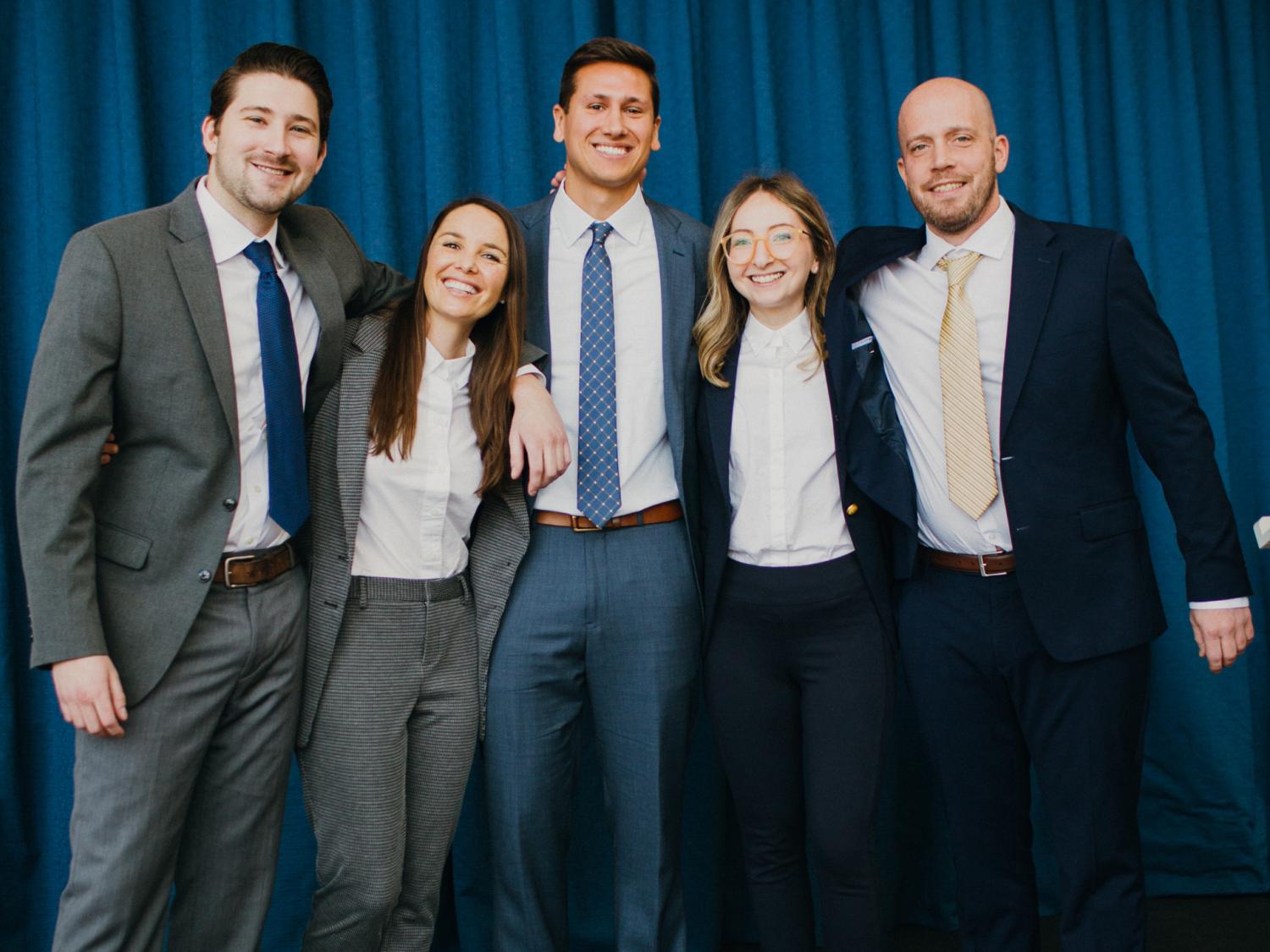 Five Smeal MBA students pose for a picture after winning a case competition