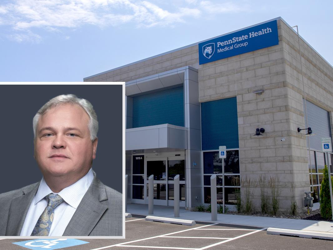 A headshot of Pete Ostasewski, in which he’s wearing a suit and tie, superimposed over a photo of a Penn State Health Medical Group clinic.