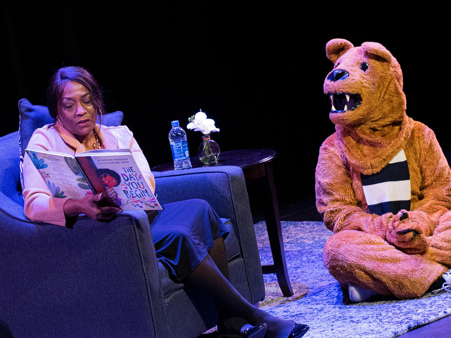 Wanda Knight, assistant dean for diversity, equity and inclusion at Penn State Harrisburg, reads a book to the Nittany Lion.