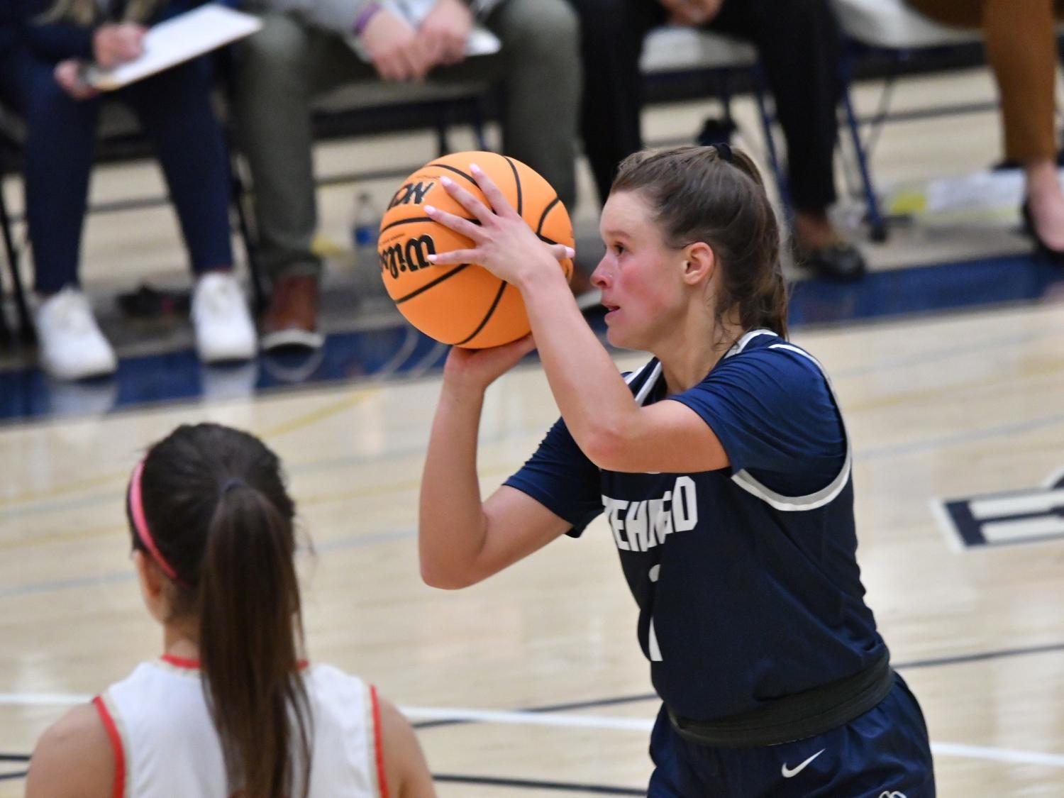 A player for the Penn State Behrend women's basketball team attempts a free throw.