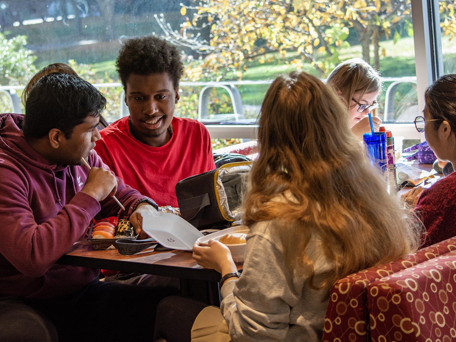 Peer mentors and Career studies students gather for lunch.