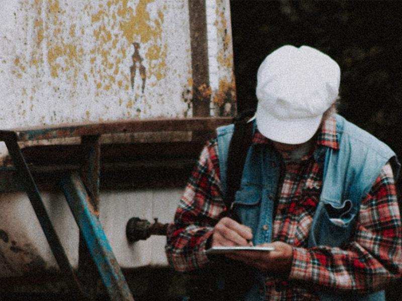 Agricultural worker taking notes.