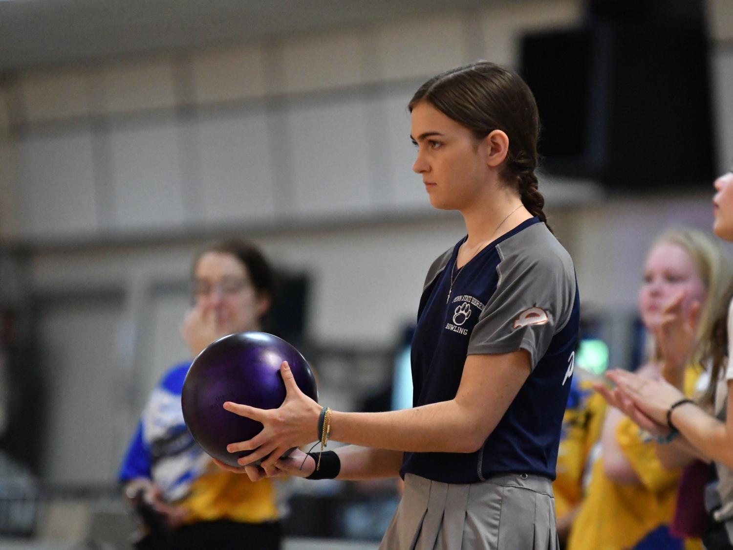 A member of the Penn State Behrend women's bowling team prepares to roll the ball.