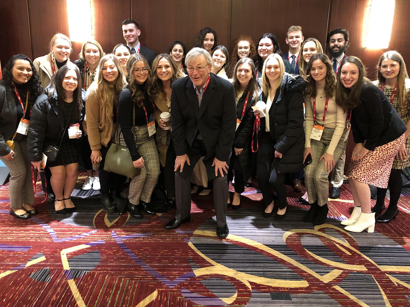 A photo of Fred Hurvitz with a group of Smeal students.