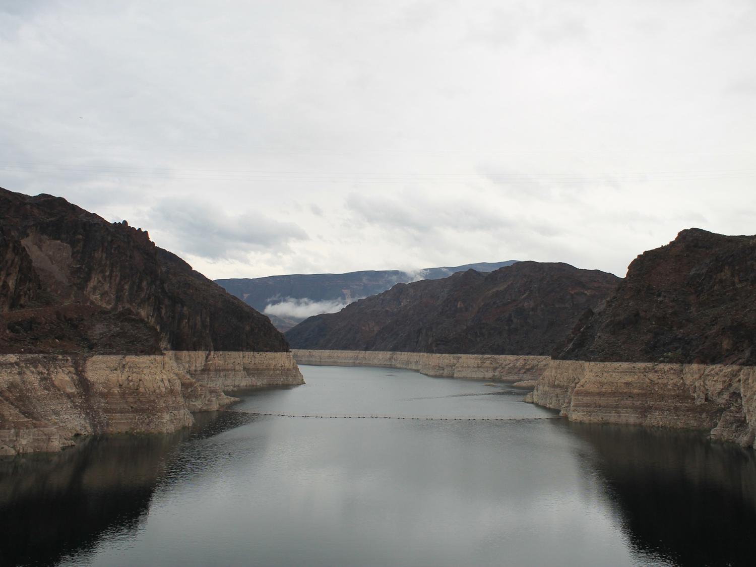 An image of Lake Mead that shows a white line indicating how far the water level has dropped 