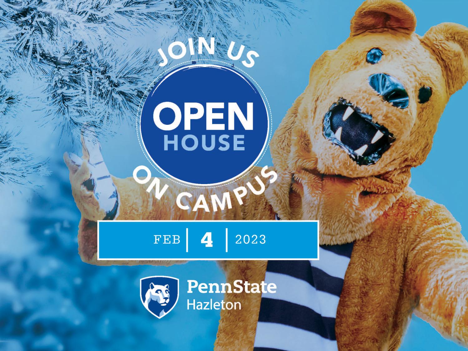 Nittany Lion with arms outstretched next to snow-covered tree.