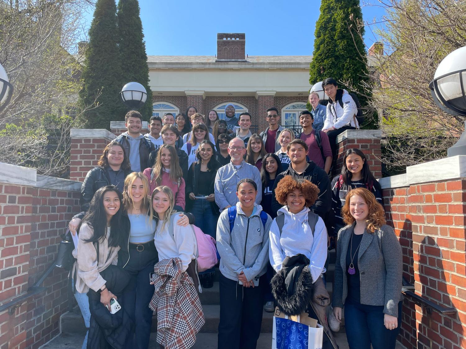 2022 presidential leadership academy standing on the stairs outside of Atherton Hall