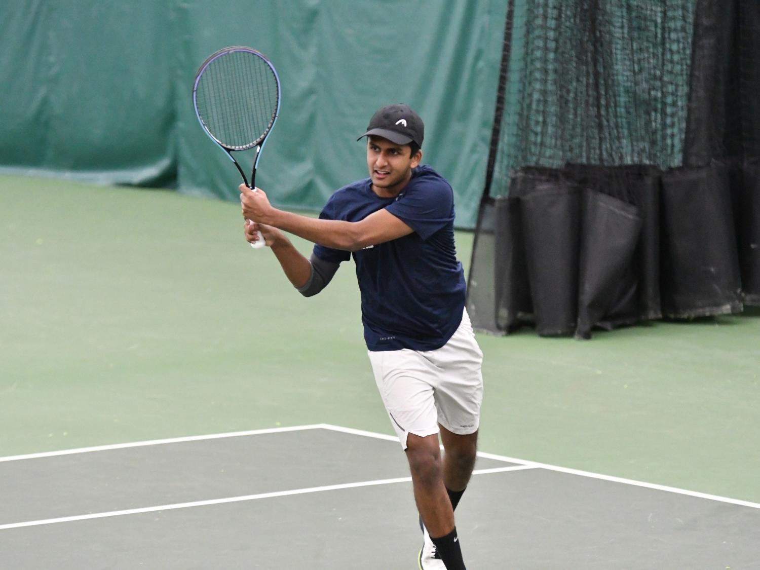 Penn State Behrend tennis player Ritvik Nadikude hits a backhand.