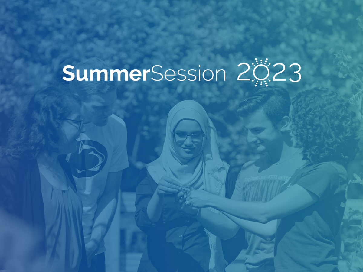 Summer Session 2023 / A group of students outside examining foliage