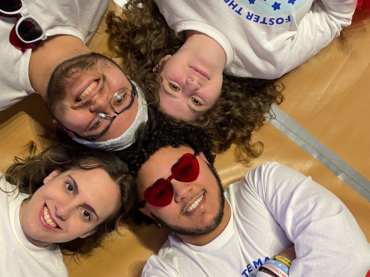 PSU-LV THON 2023 Dancers laying on the court of the Bryce Jordan Center