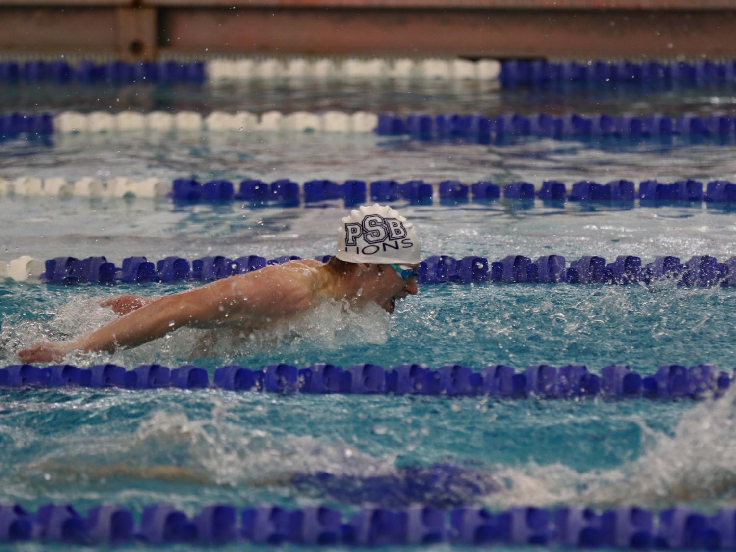 Penn State Behrend swimmer Tim Compton competes in a butterfly race.