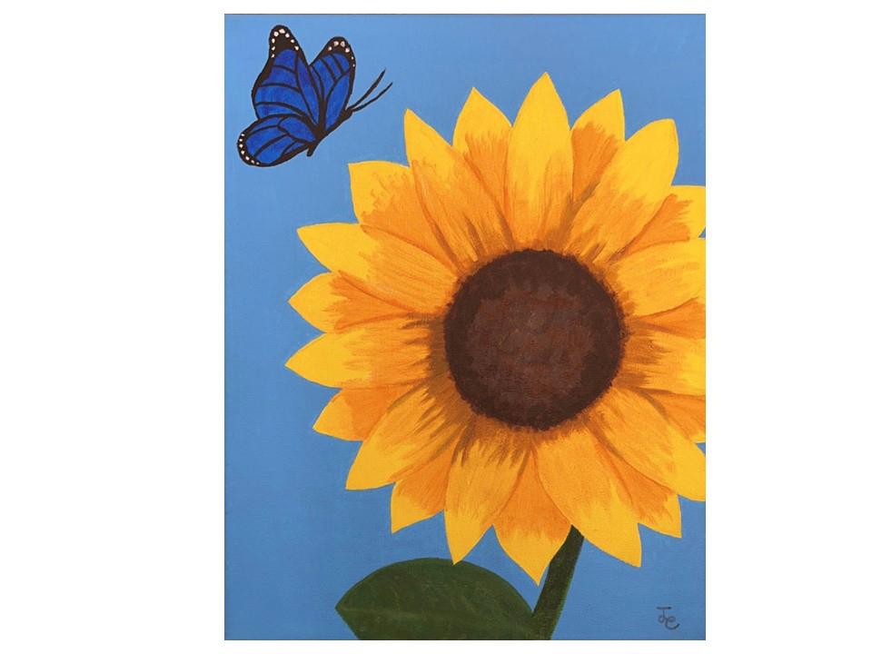 Sunflower on a painted blue background with a butterfly hovering in upper left corner