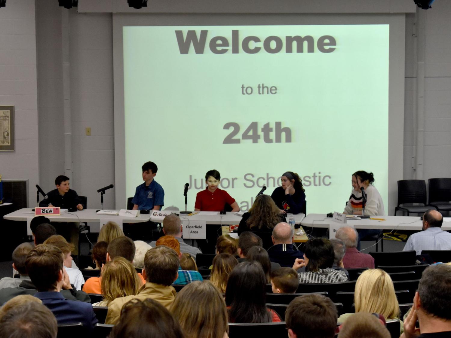 Participants prepare to answer questions during their preliminary round during the junior scholastic challenge in the Hiller Auditorium at Penn State DuBois