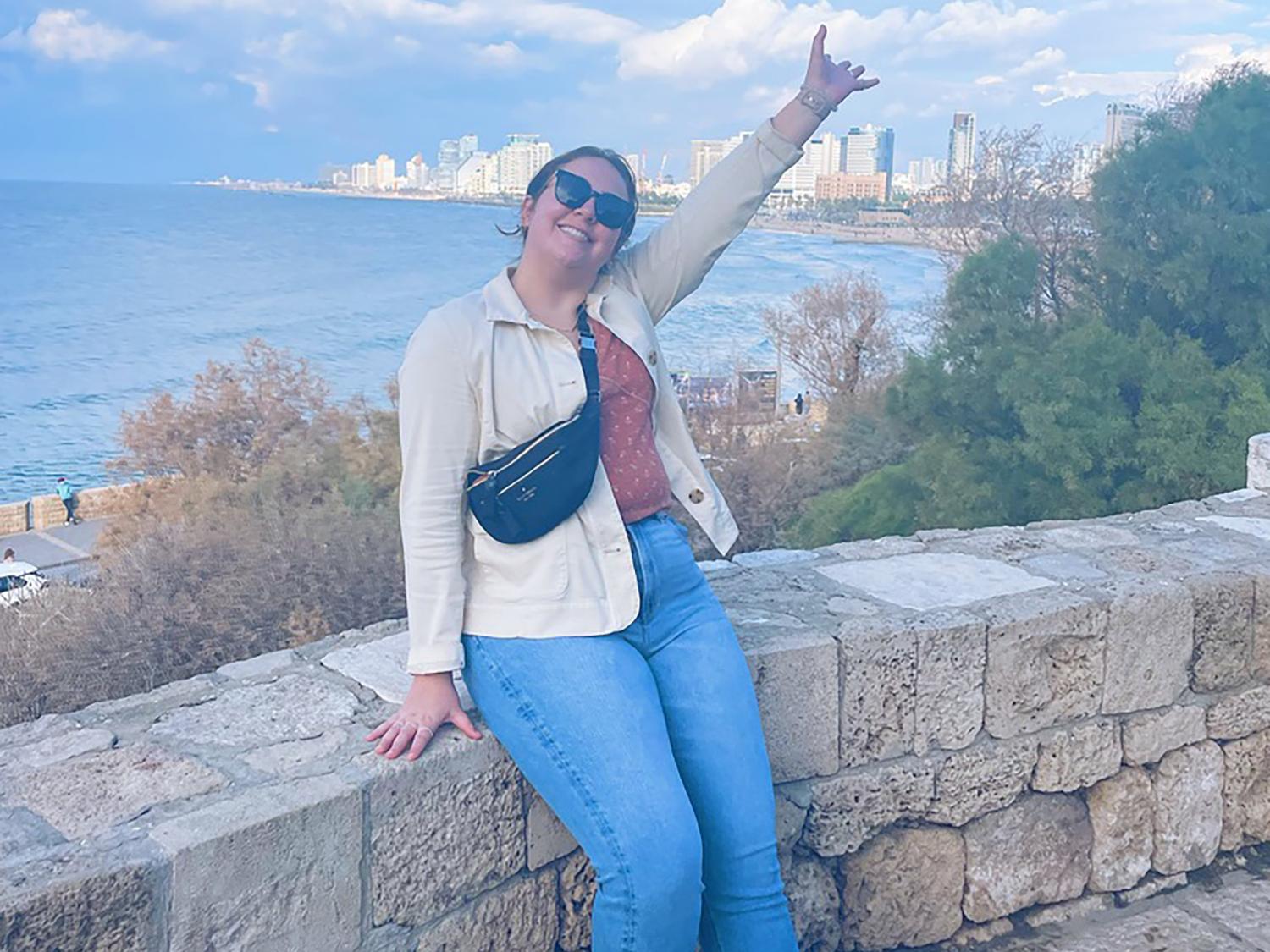 Jordynn Cheatle posing for a photograph near the beach in Israel