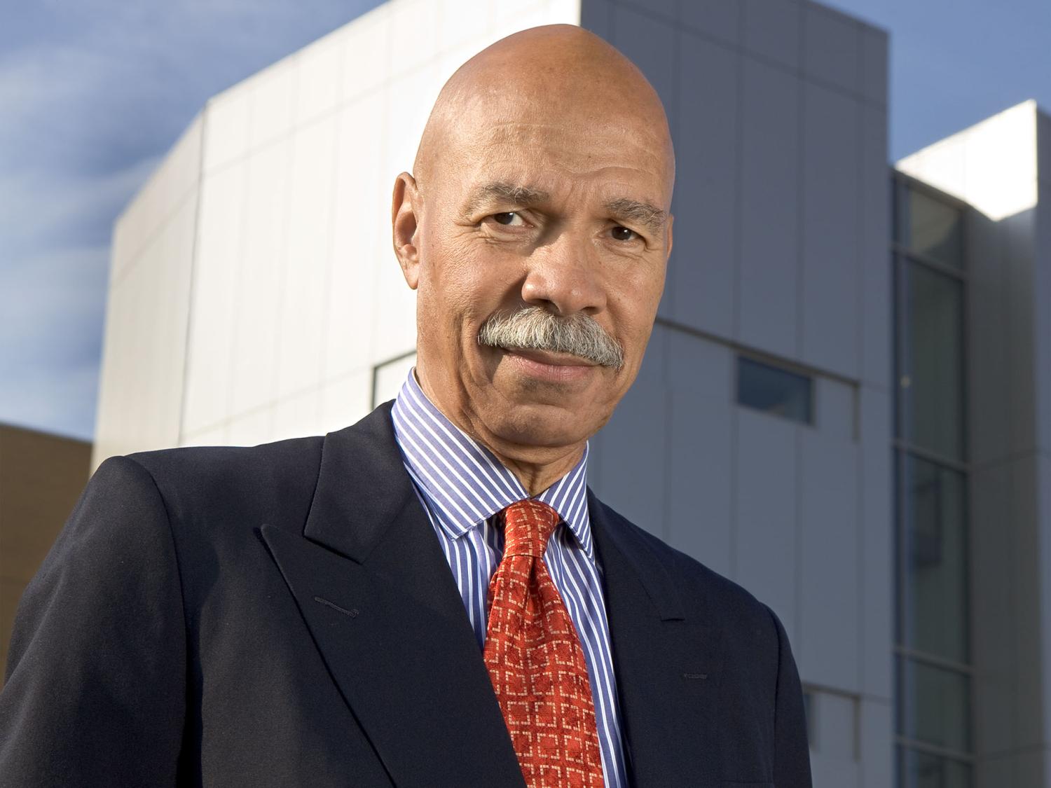Randall Robinson wearing a suit and tie.