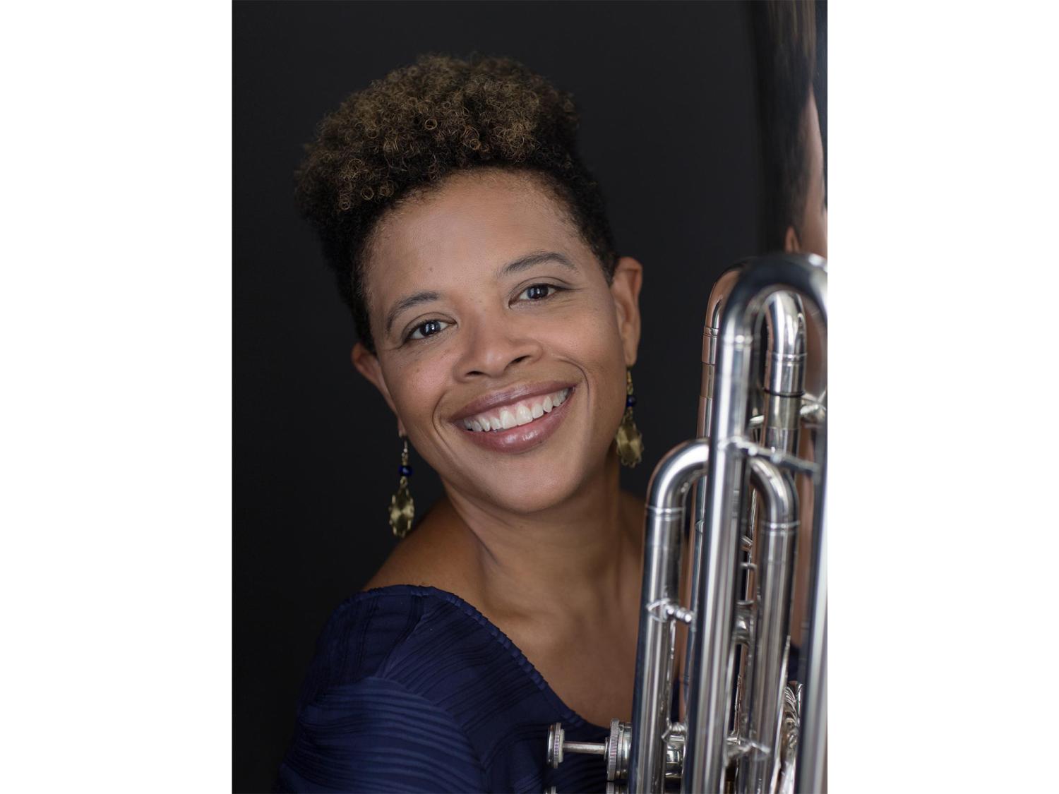 Velvet Brown posing with a tuba