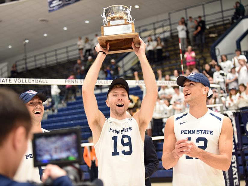 Player holds up trophy