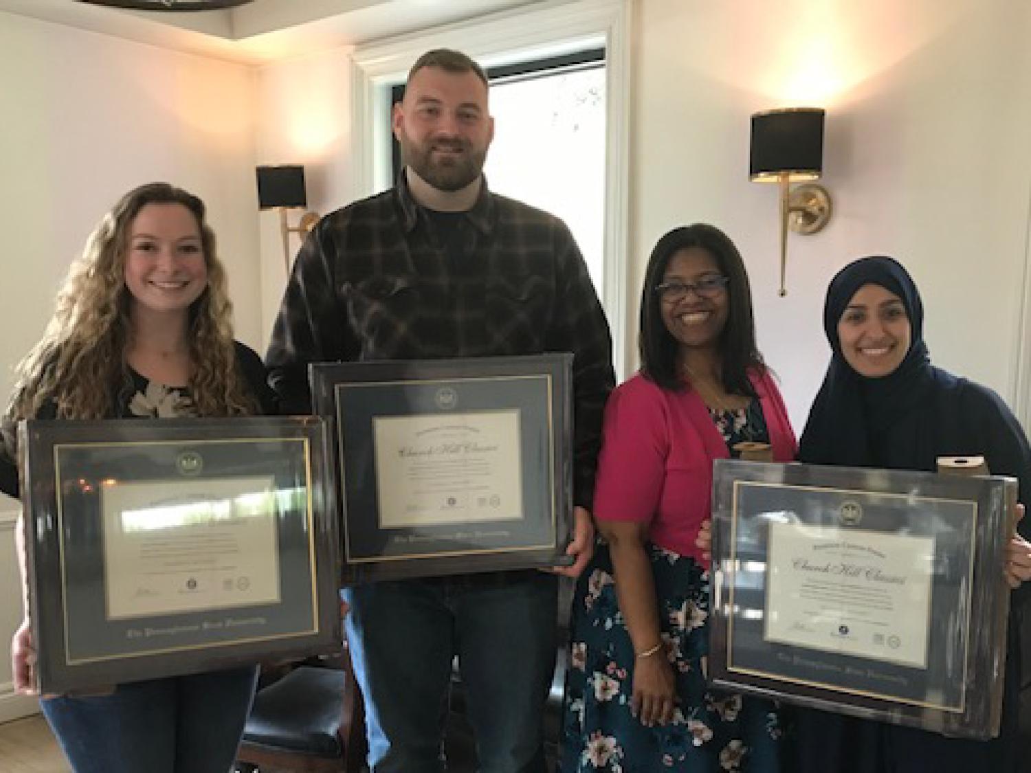 Recipients of the 2023 Outstanding Adult Student Award posing with director Leslie Laing and their awards