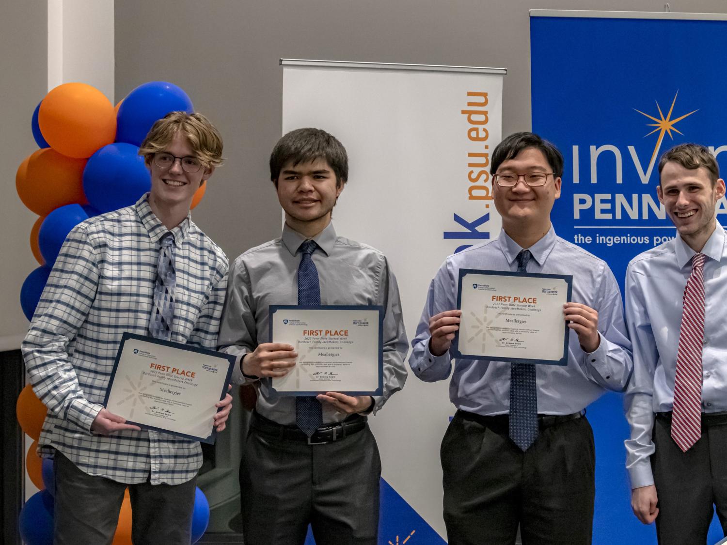 Four male students hold certificates showing they won the Bardusch Family Ideamakers Challenge.