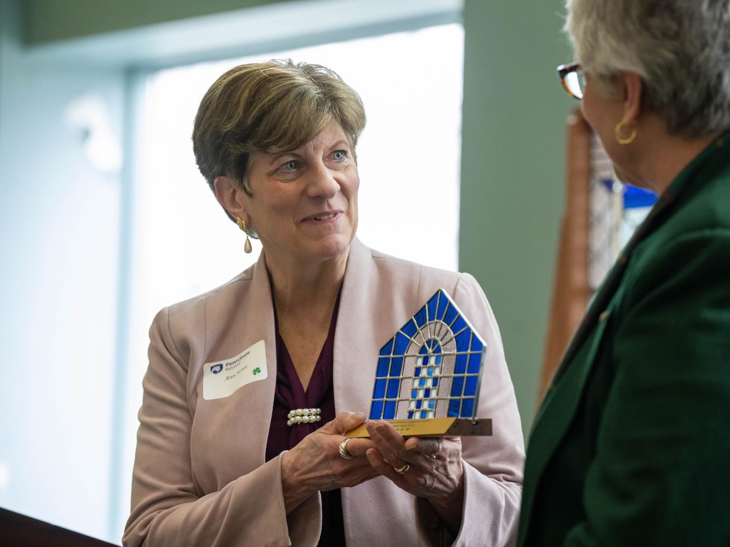 Ann Scott of Erie Insurance Group accepts the Mary Behrend Impact Award.